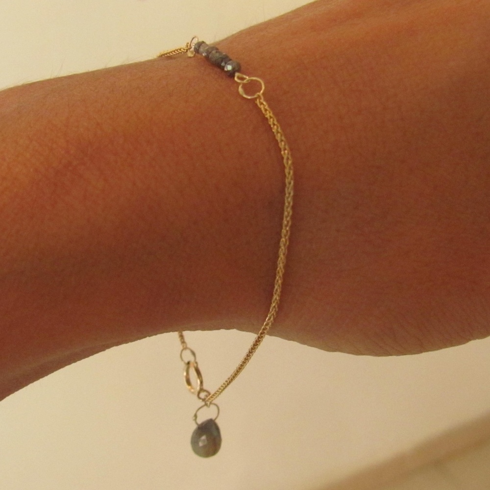 Gold bracelet with rough diamonds and labradorite.